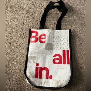 small red black and white lulu bag